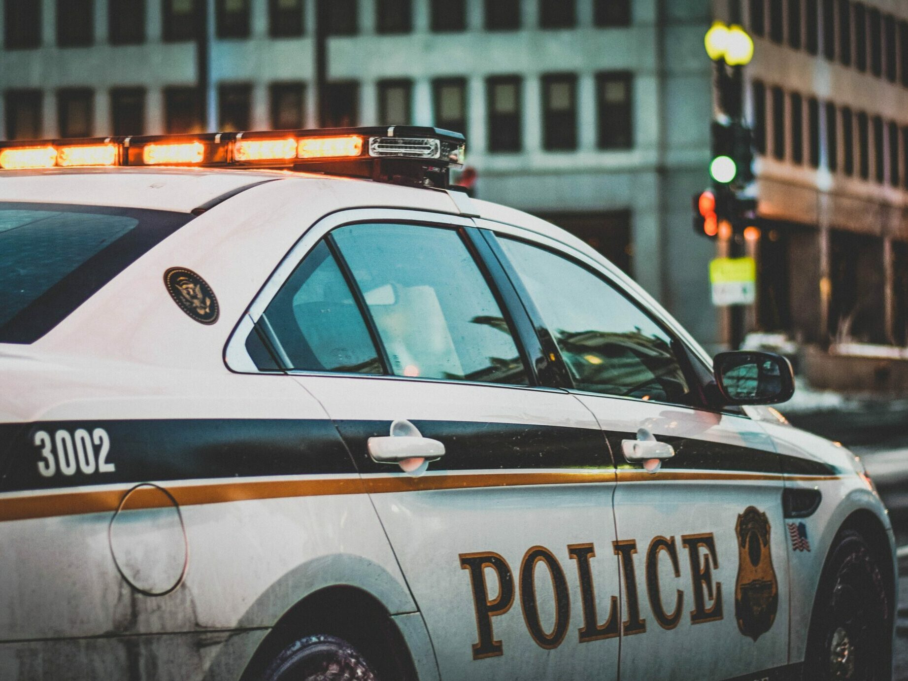 A police car belonging to the United States Secret Service Uniformed Division patrols a street adjacent to the White House in Washington, DC.