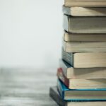 assorted books on wooden table