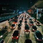 Photo of vehicles on road during evening