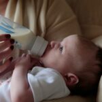 Baby feeding from a bottle