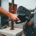 person holding black corded device