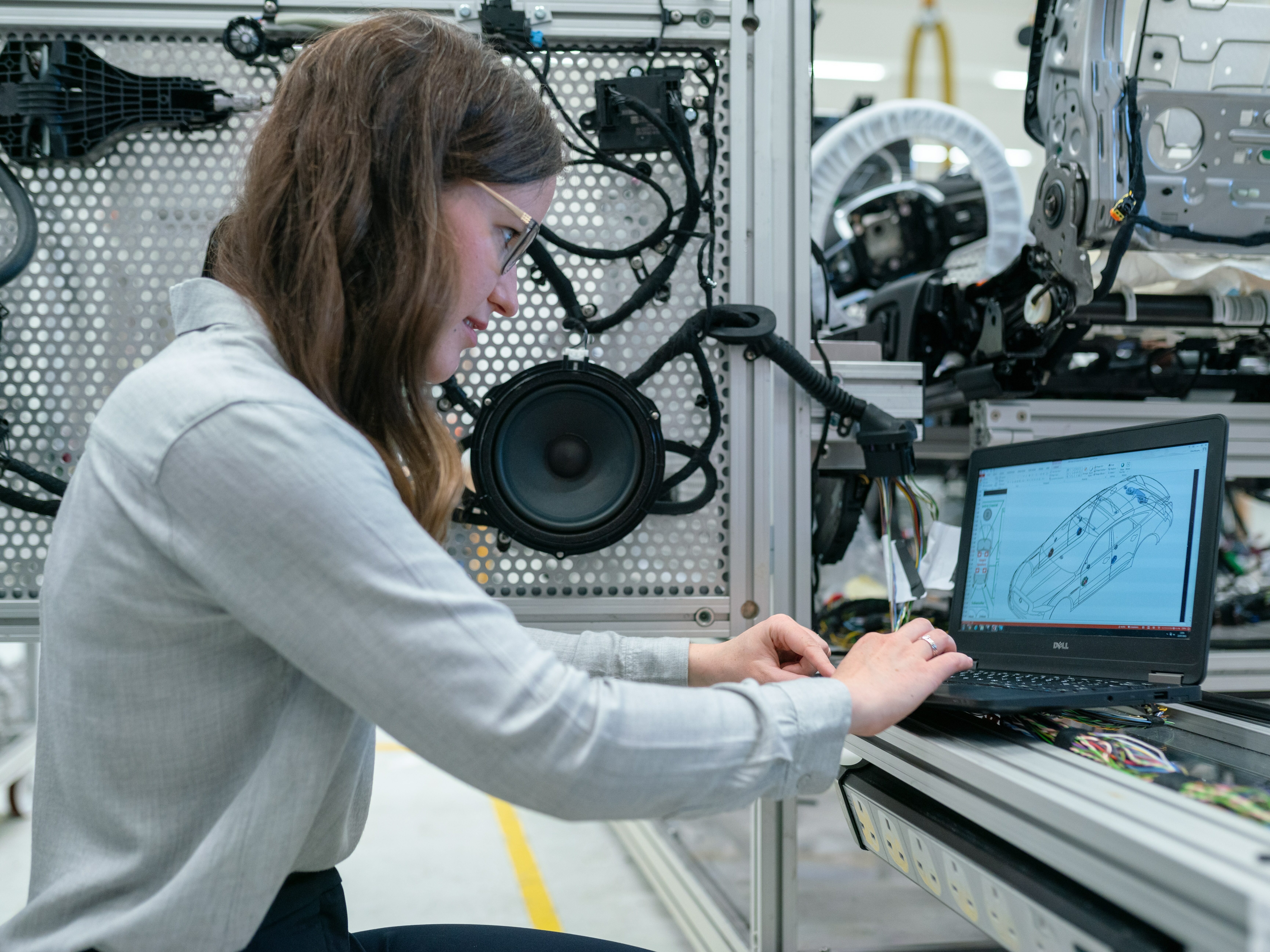 Female electronics engineer runs vehicle tests