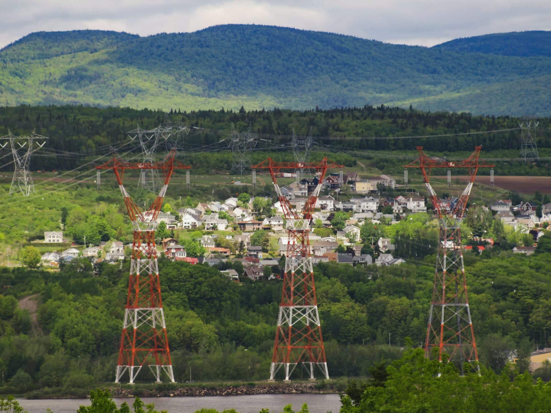 High voltage electrical grid pylons crossing the St. Lawrence River