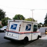 white and blue van on road during daytime