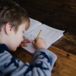 Child completing maths homework