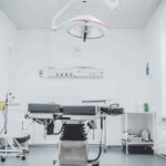 black and white hospital bed in the middle of interior building