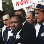 Caption reads, "[Civil Rights March on Washington, D.C. [Dr. Martin Luther King, Jr. and Mathew Ahmann in a crowd.], 8/28/1963" Original black and white negative by Rowland Scherman. Taken August 28th, 1963, Washington D.C, United States (The National Archives and Records Administration). Colorized by Jordan J. Lloyd. U.S. Information Agency. Press and Publications Service. ca. 1953-ca. 1978. https://catalog.archives.gov/id/542015