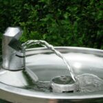 Metal drinking fountain, running water