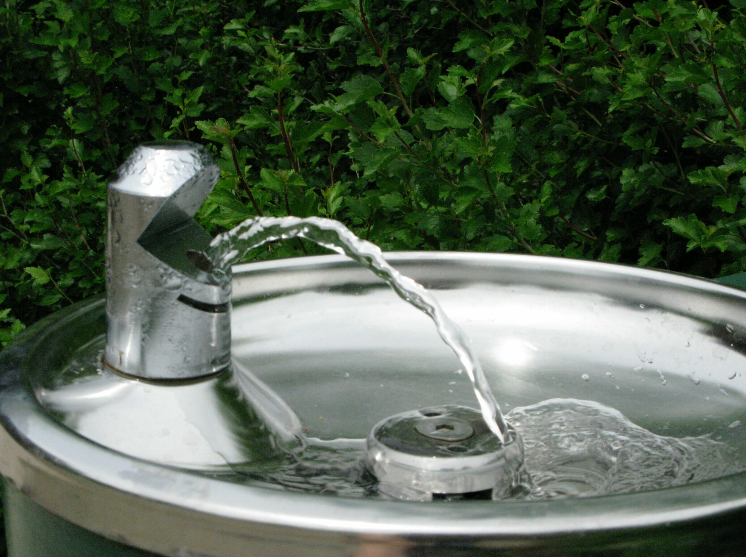 Metal drinking fountain, running water