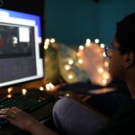 man in black shirt using computer