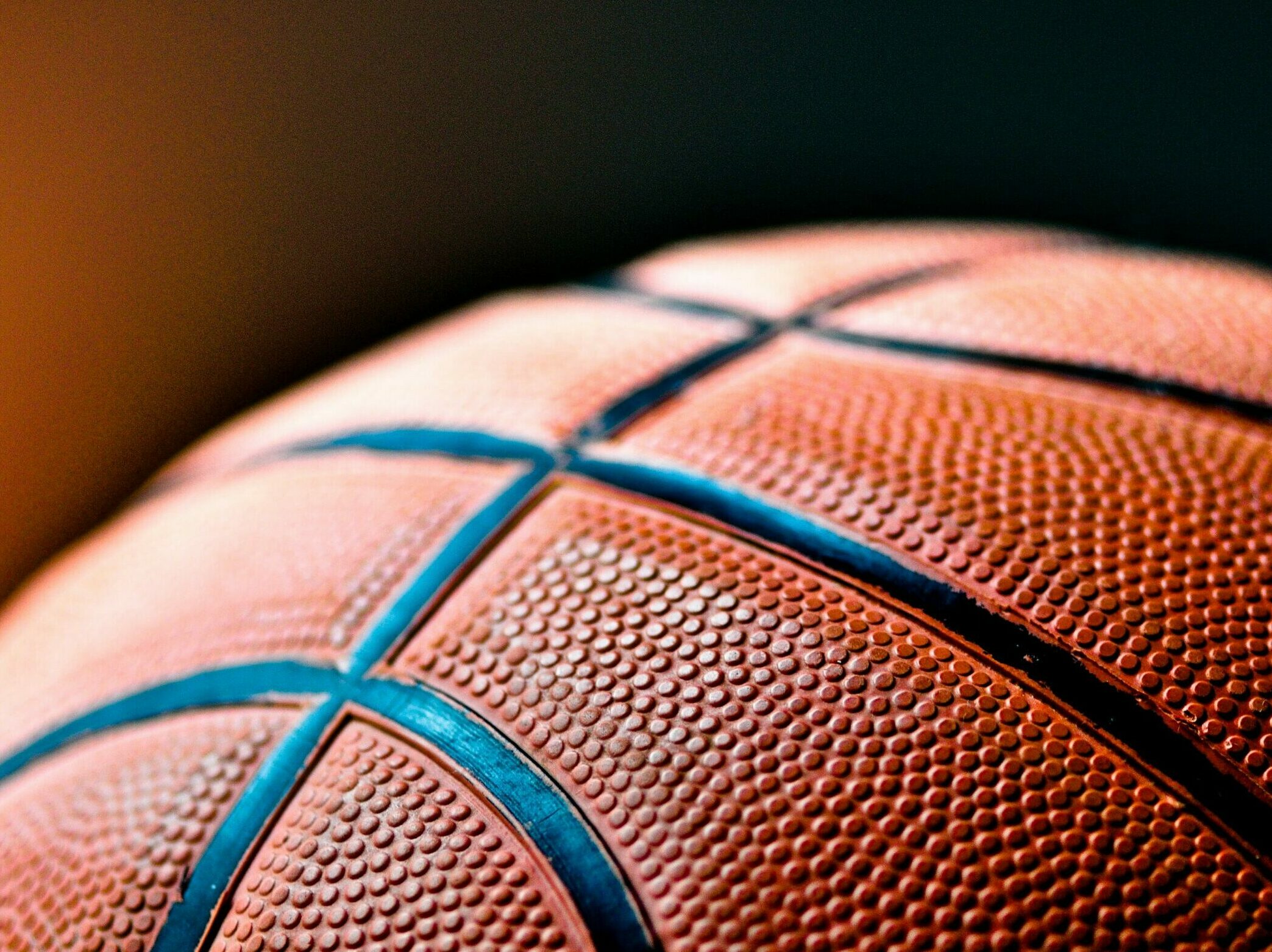 brown and black basketball ball