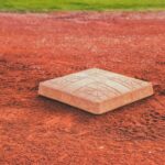 square brown concrete baseball base on soil