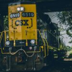 yellow and black CSX train