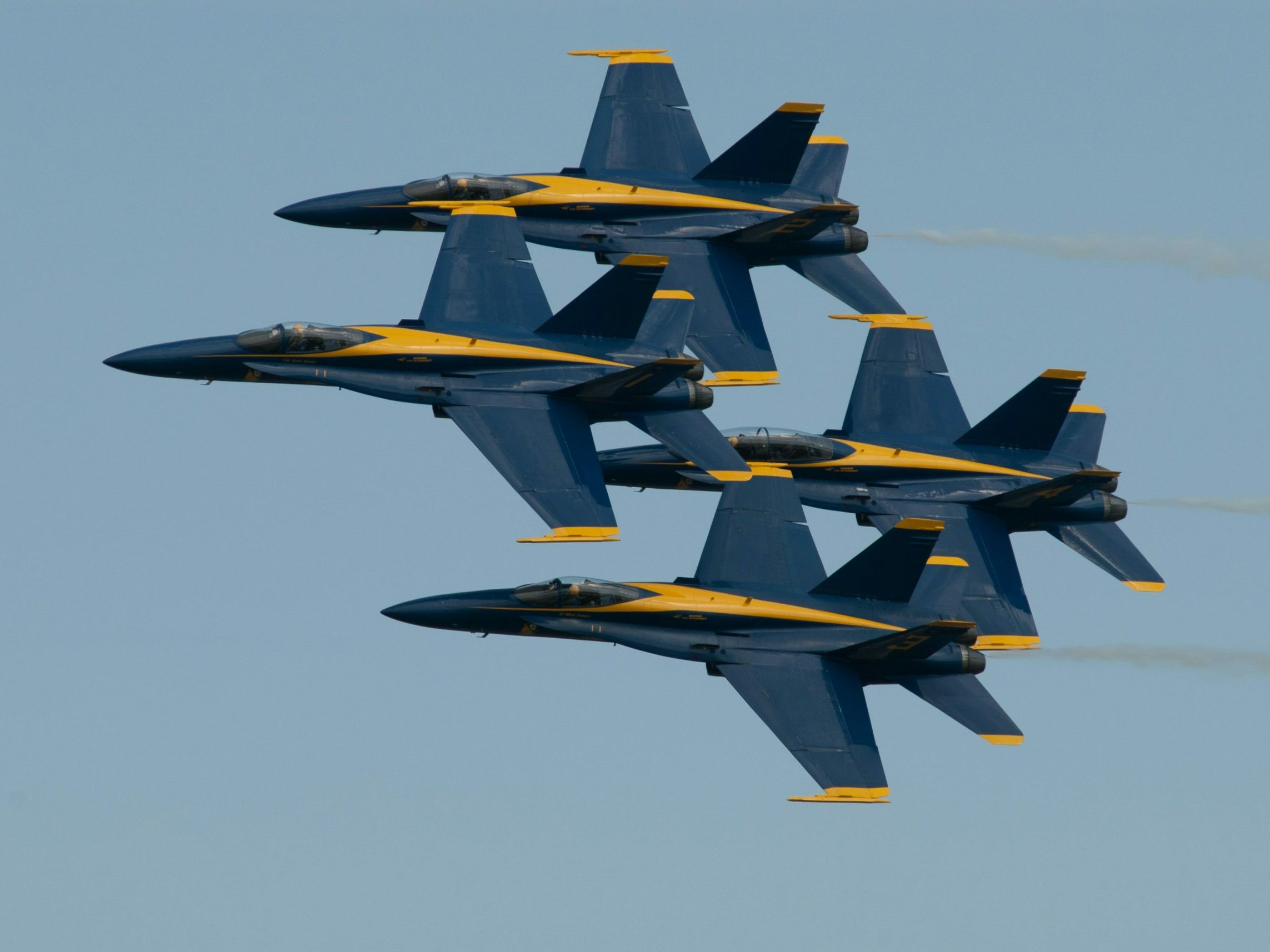 The Blue Angels are well known for flying extremely tight formations, and this is an excellent example. Taken on a hot and steamy day at Joint Base Andrews air show - that’s where they keep Air Force One.