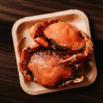 a close up of a plate of crab on a table