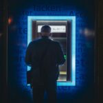 A man withdrawing money from his bank account