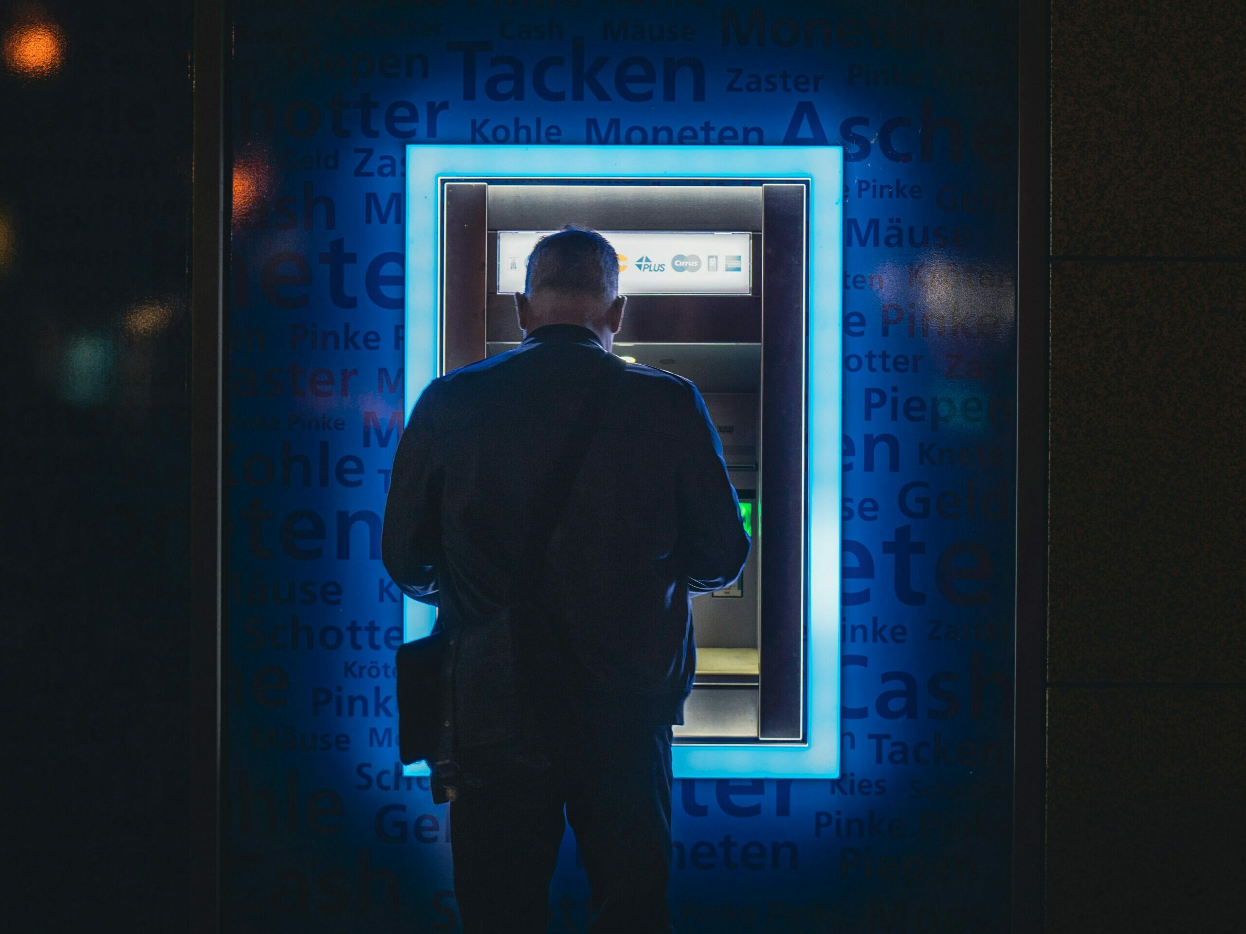 A man withdrawing money from his bank account