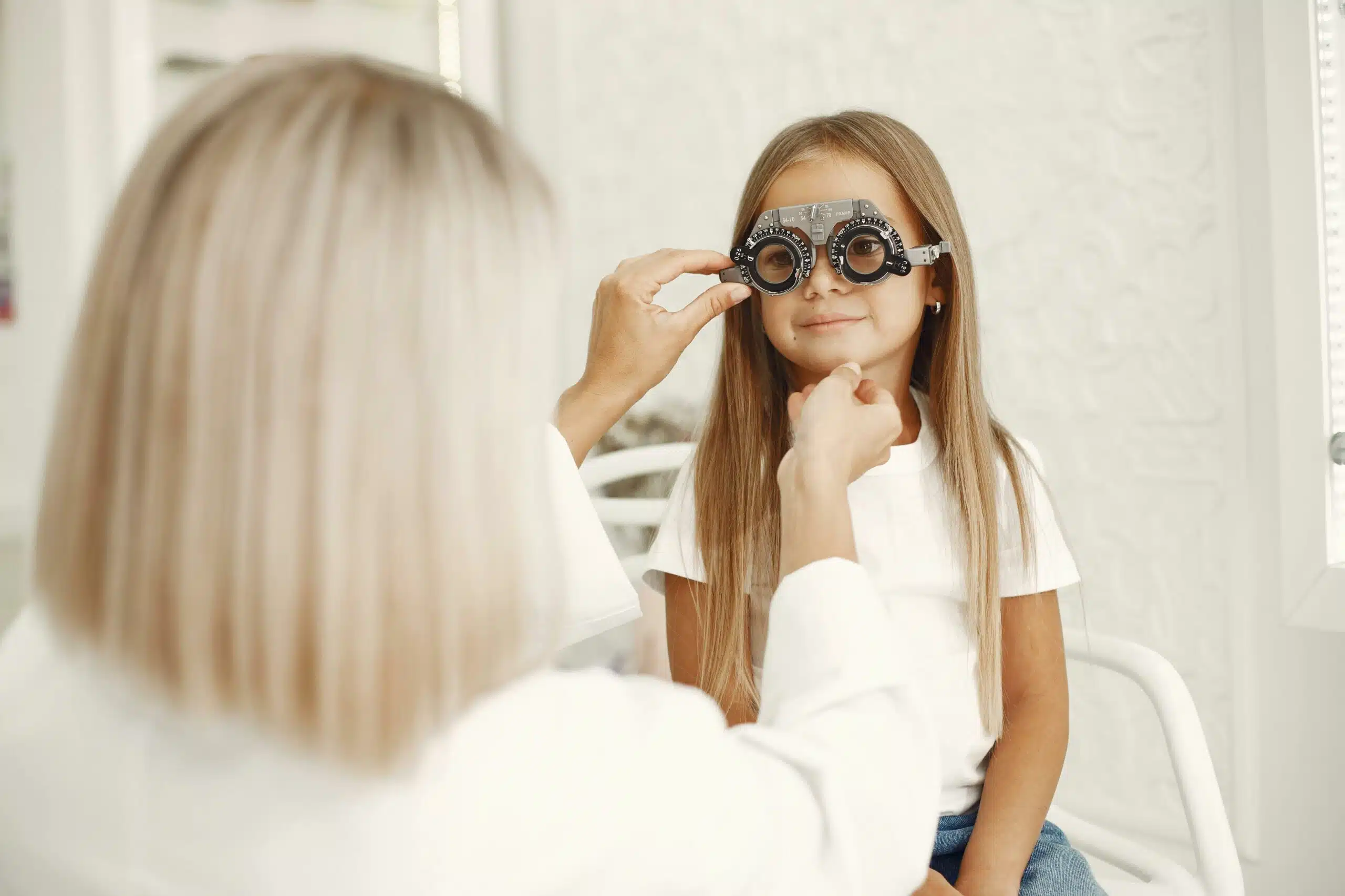 Girl having eye exam at optometrists office