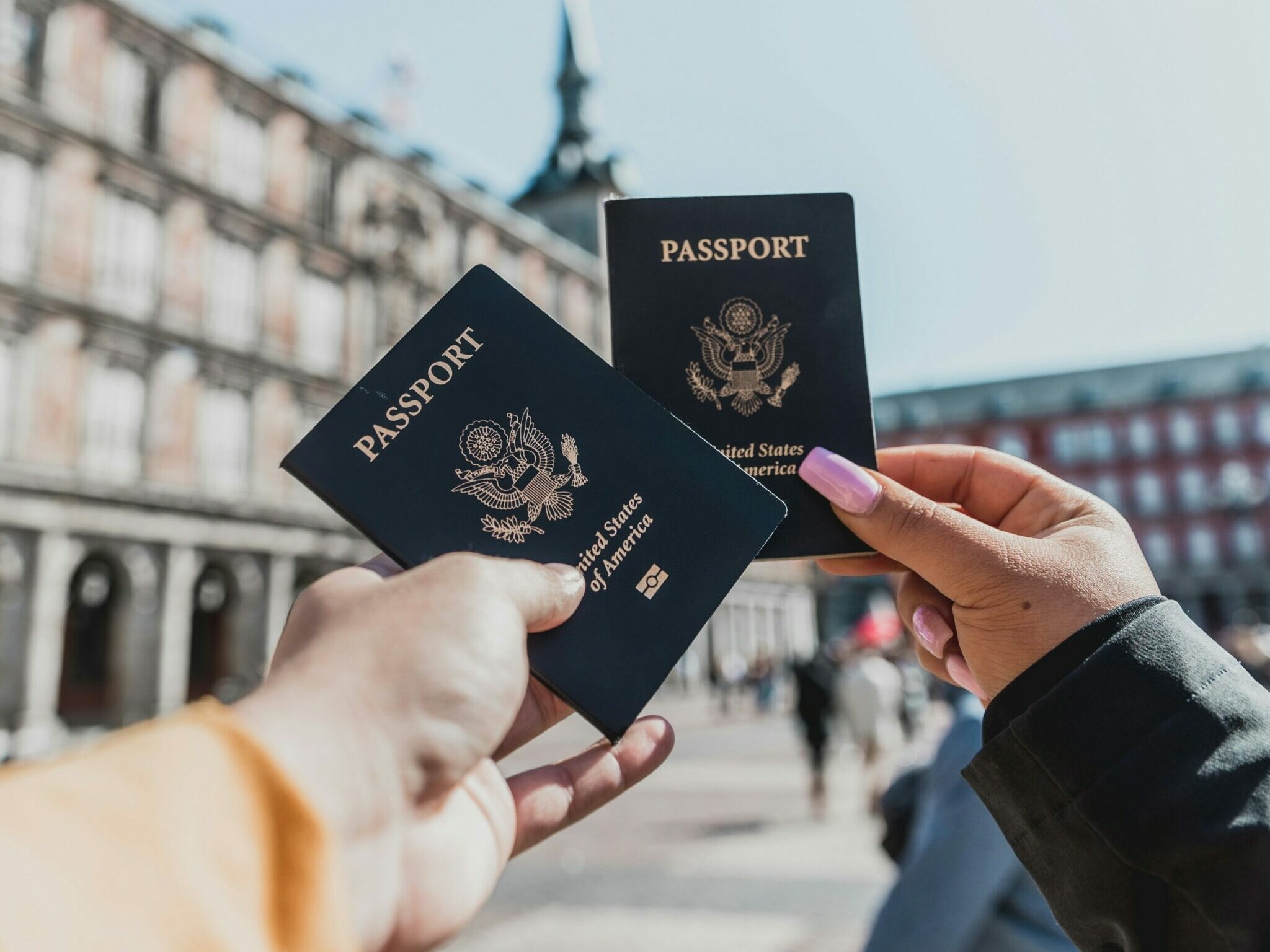 person holding passports