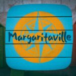 a blue and yellow sign that reads margaritaville