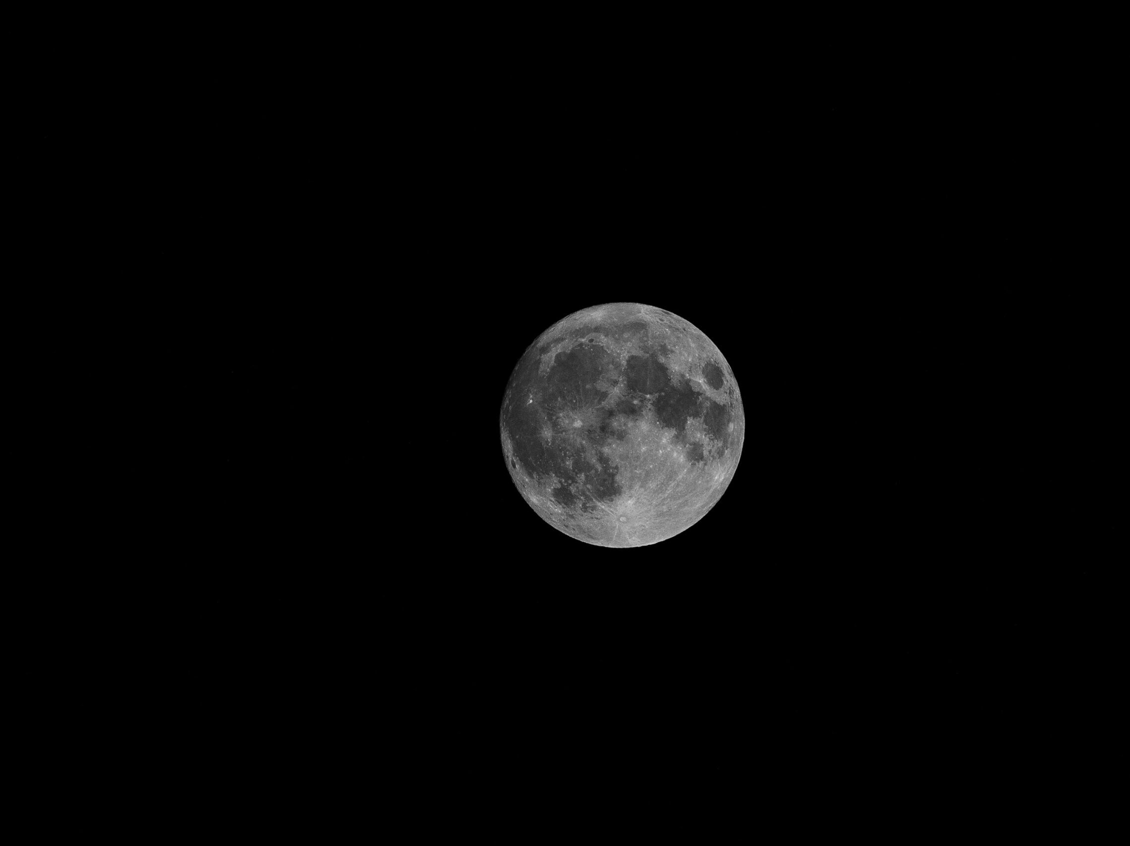 full moon in dark night sky