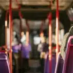 person standing in transportation vehicle