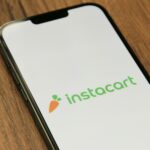 a phone with the instocart logo on it