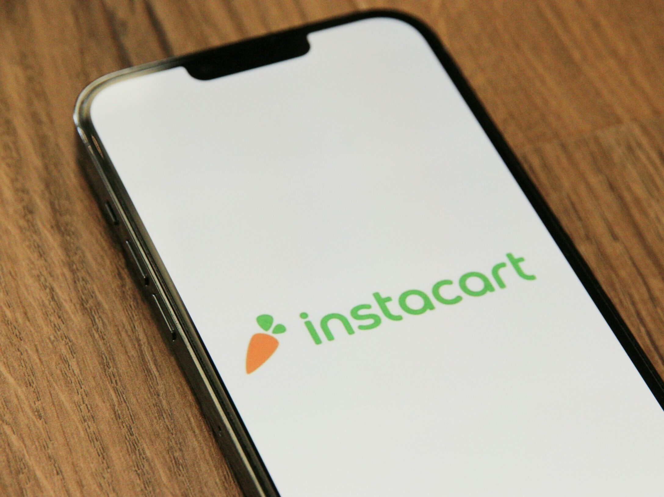 a phone with the instocart logo on it