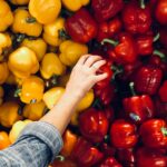 person holding bell pepper