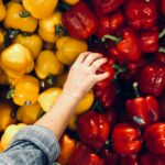 person holding bell pepper