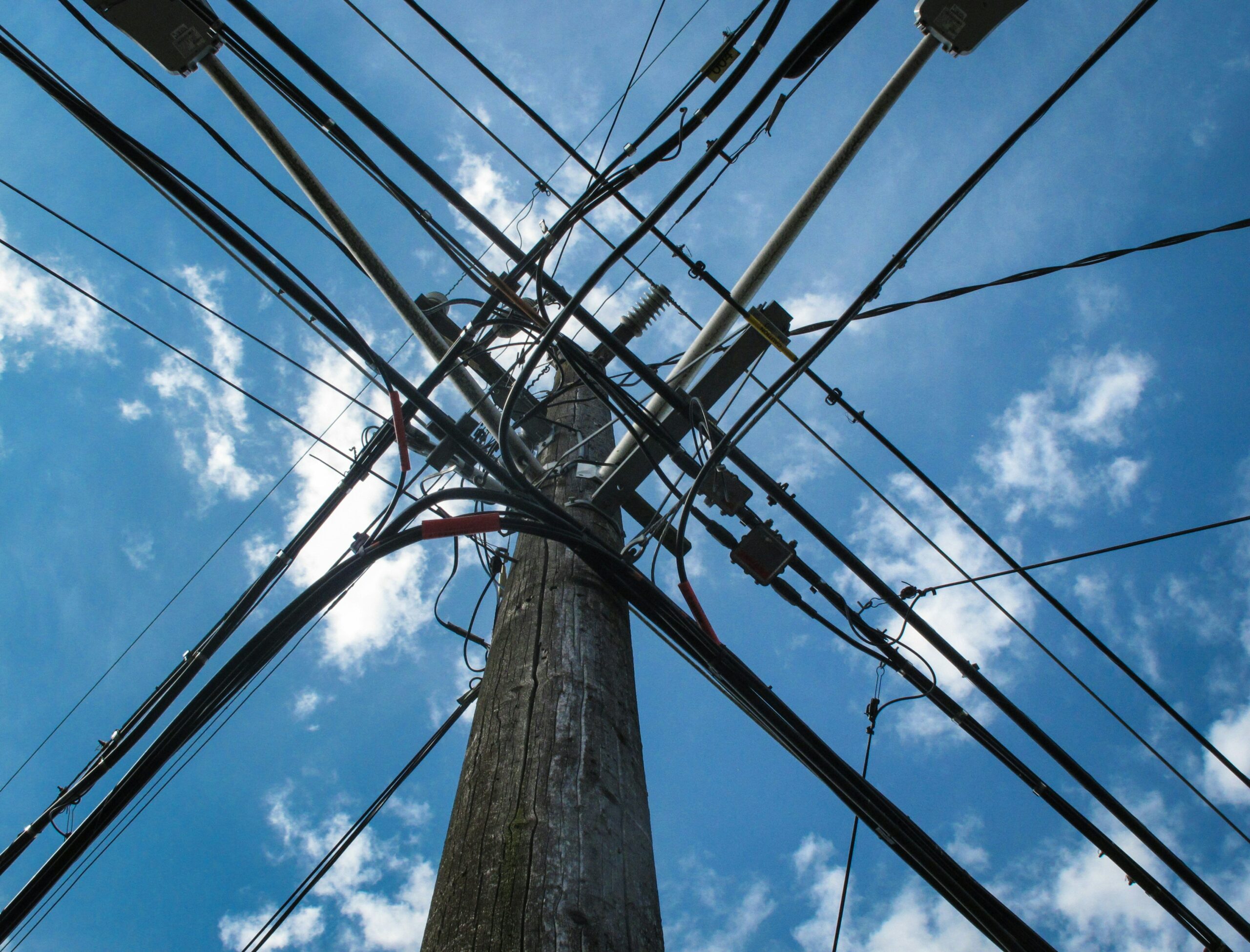 I focused on a subject that a source of frustration to an urban photographer - countless ubiquitous wires and cables crisscrossing nearly every location. here , They display a powerful geometry and symbolism against a perfect blue sky,